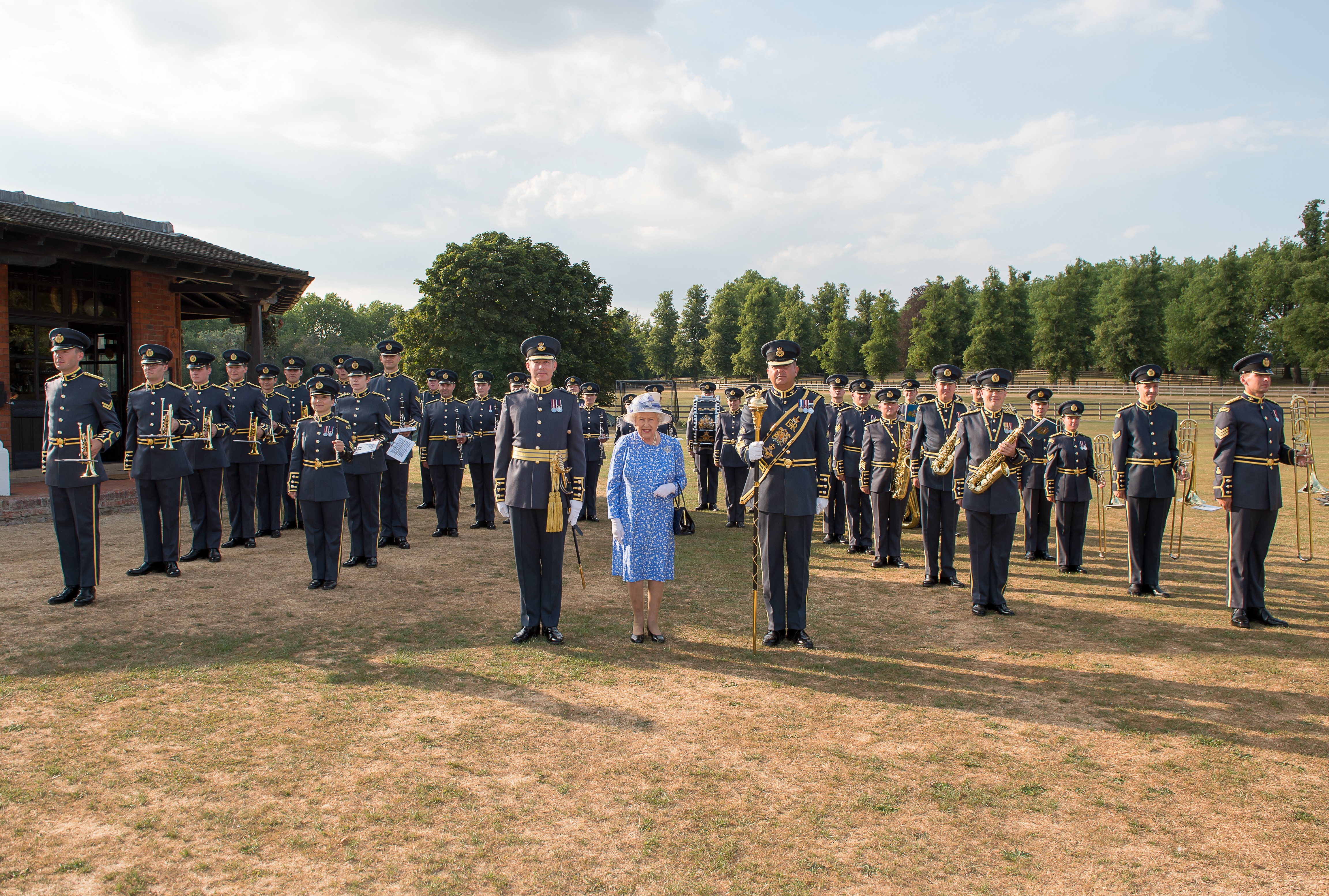 Wing Commander Piers Morrell OBE MVO pictured with Her Majesty The Queen and the Central Band of the RAF.