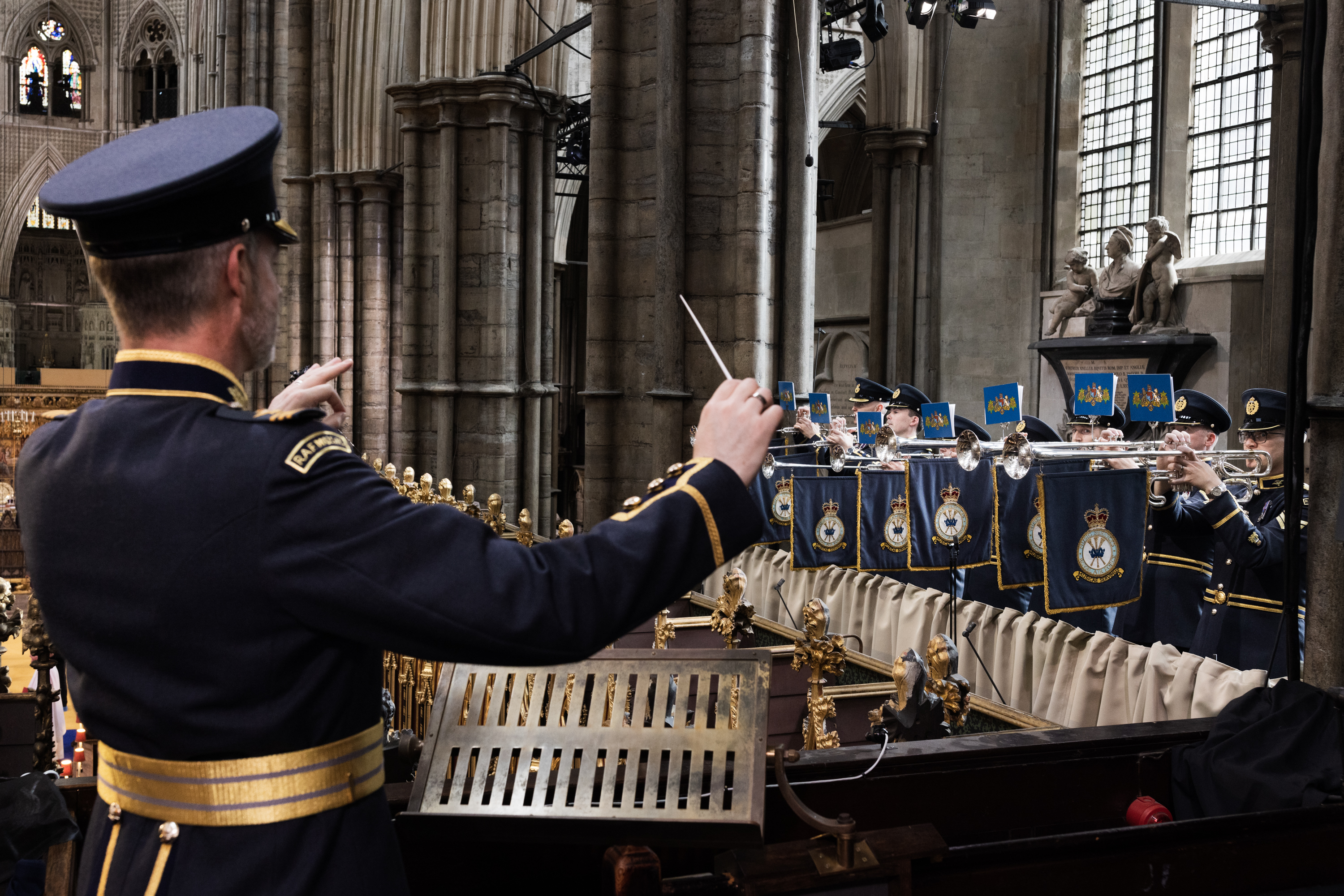 Wing Commander Piers Morrell conducting the Fanfare Trumpeters of the RAF during the Coronation Service at Westminster Abbey