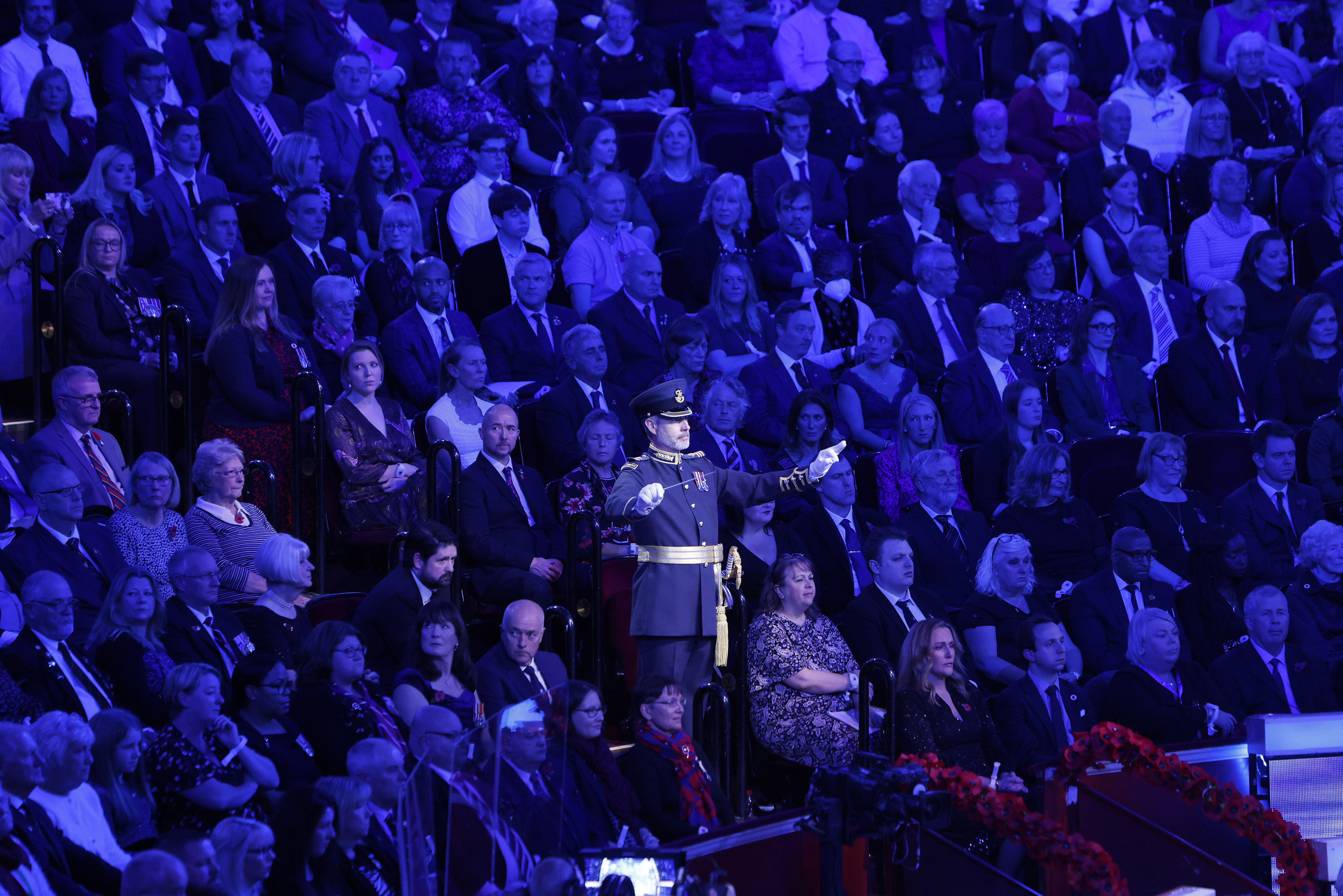 Wing Commander Piers Morrell conducting 'Old Comrades' at the Festival of Remembrance