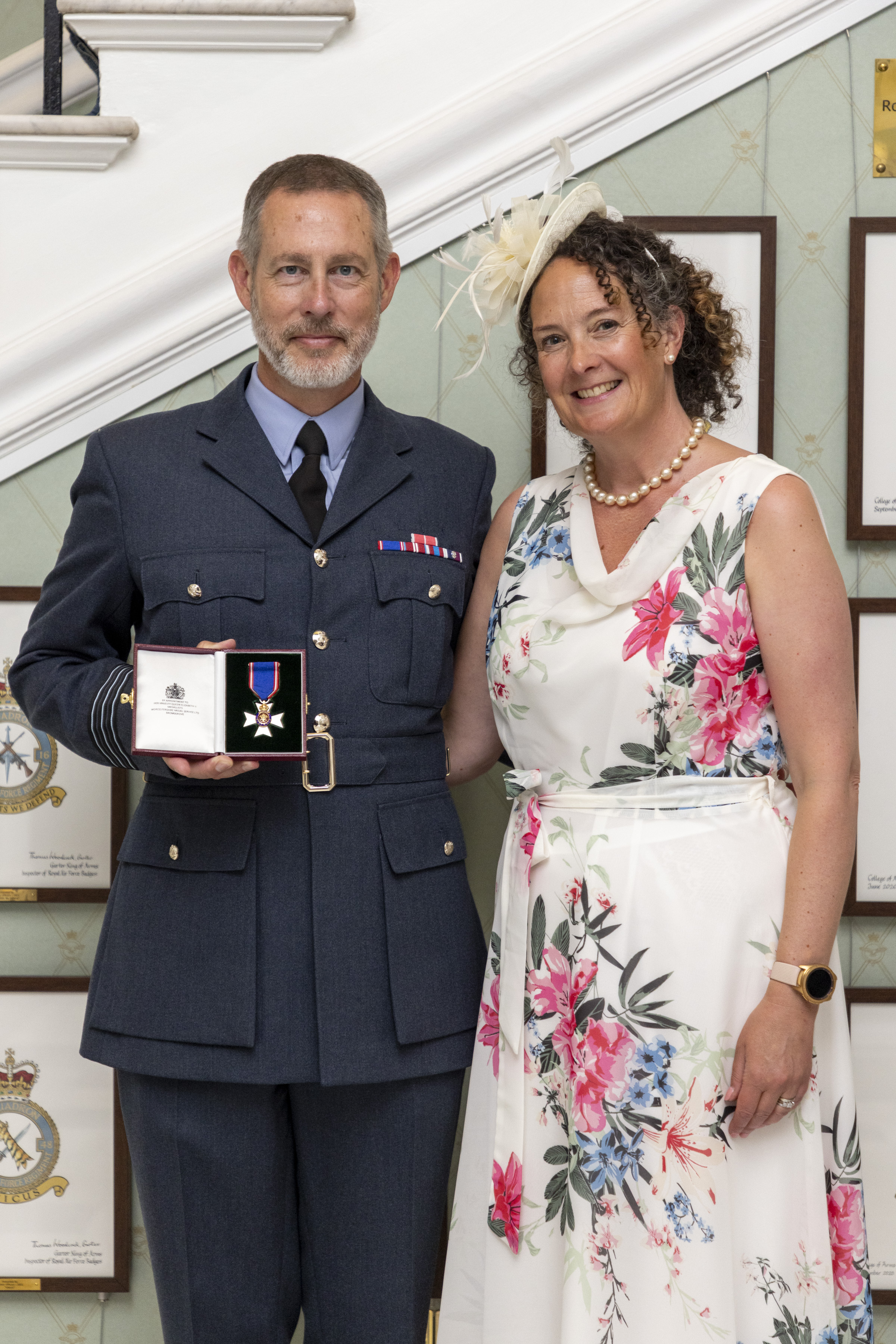 Wing Commander Piers Morrell with wife Gina picture at Buckingham Palace shortly after being presented with the MVO medal