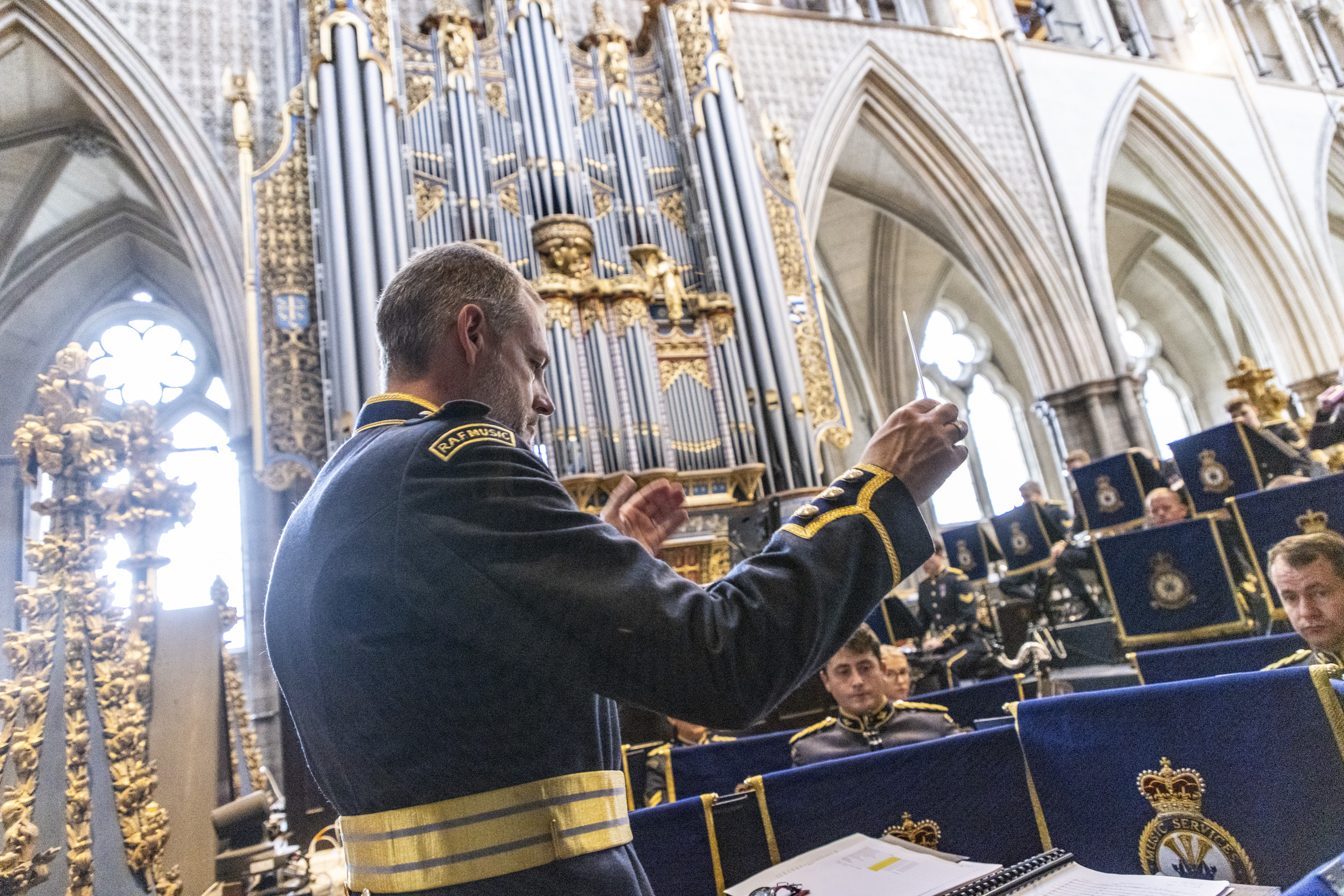 Wing Commander Piers Morrell conducts the Band of the RAF Regiment at the Battle of Britain Service for the last time before his retirement