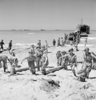 RAF personnel landing from a LST on 'Cent' beach